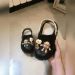 پاپوش کراکس بچه گانه نیمرو مشکی کرم فروشگاه آنلاین کفش و کتونی و صندل وبوت زنانه قدمک کتونی ارزان